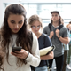 Image for article titled Report: Average American Spends 25% Of Life Waiting In Line At Cell Phone Store